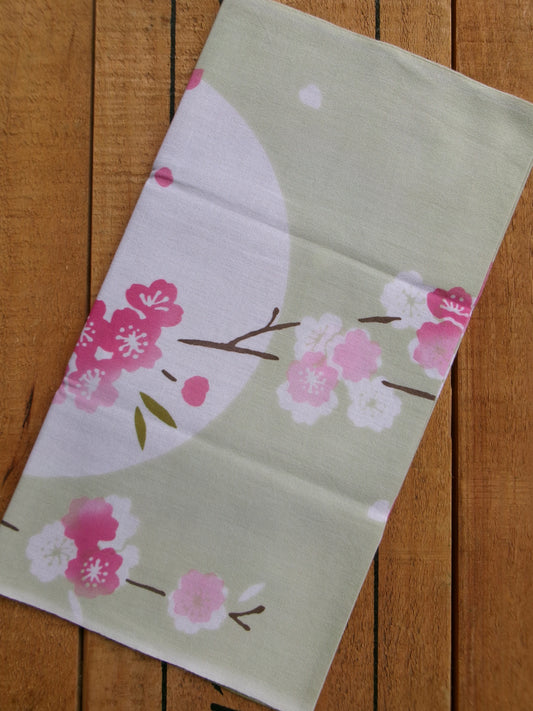 Japanese tenugui towel with cherry blossom and oboro pattern by Kamawanu, showcasing traditional fabric design and detailed floral print.