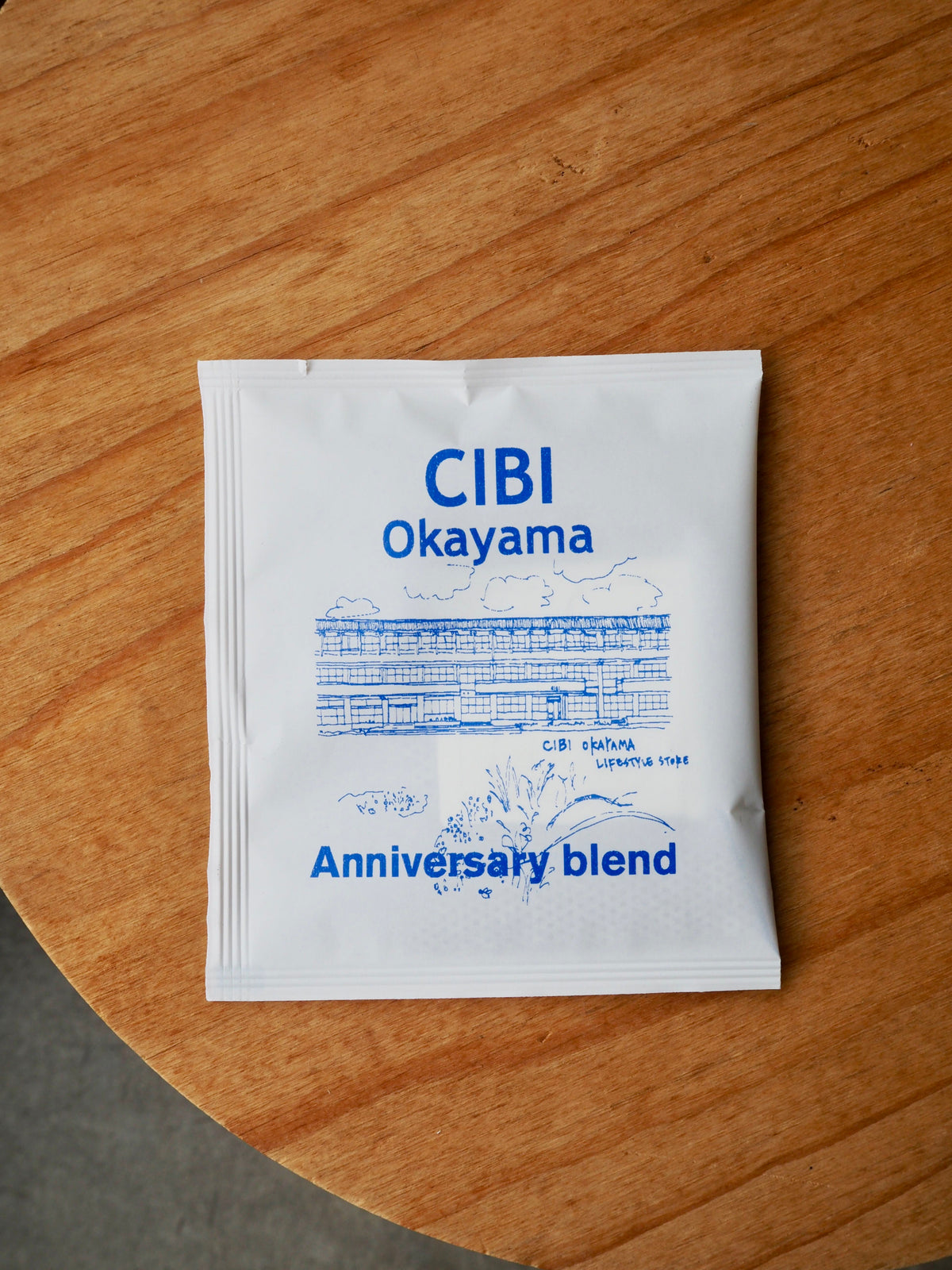 CIBI Okayama Anniversary Blend drip coffee bag with coffee grounds and brewing paper for fresh brewing.