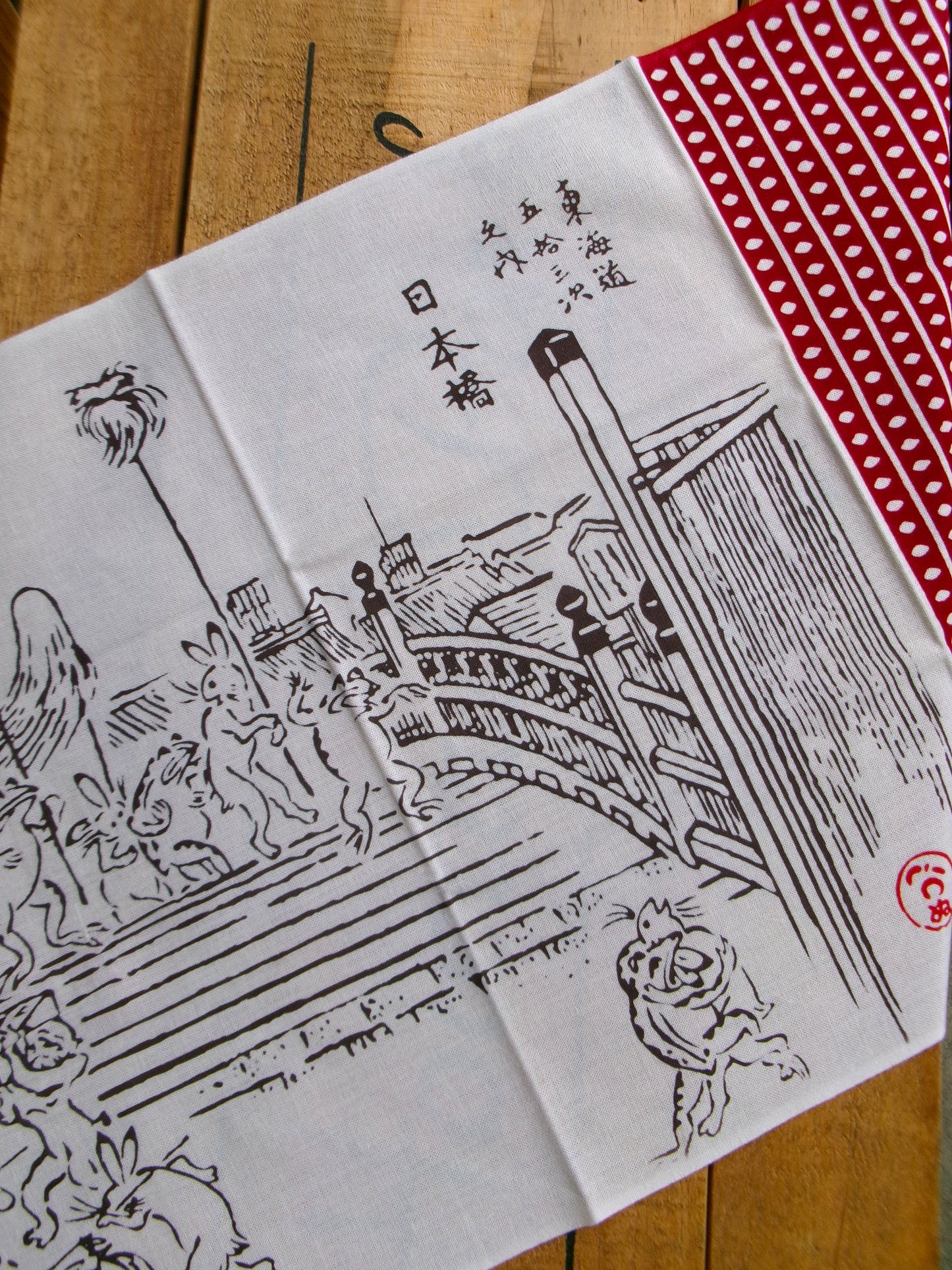 Japanese tenugui towel featuring Chōjū-giga bird and beast scene by Kamawanu, with intricate traditional artwork and vibrant colors.
