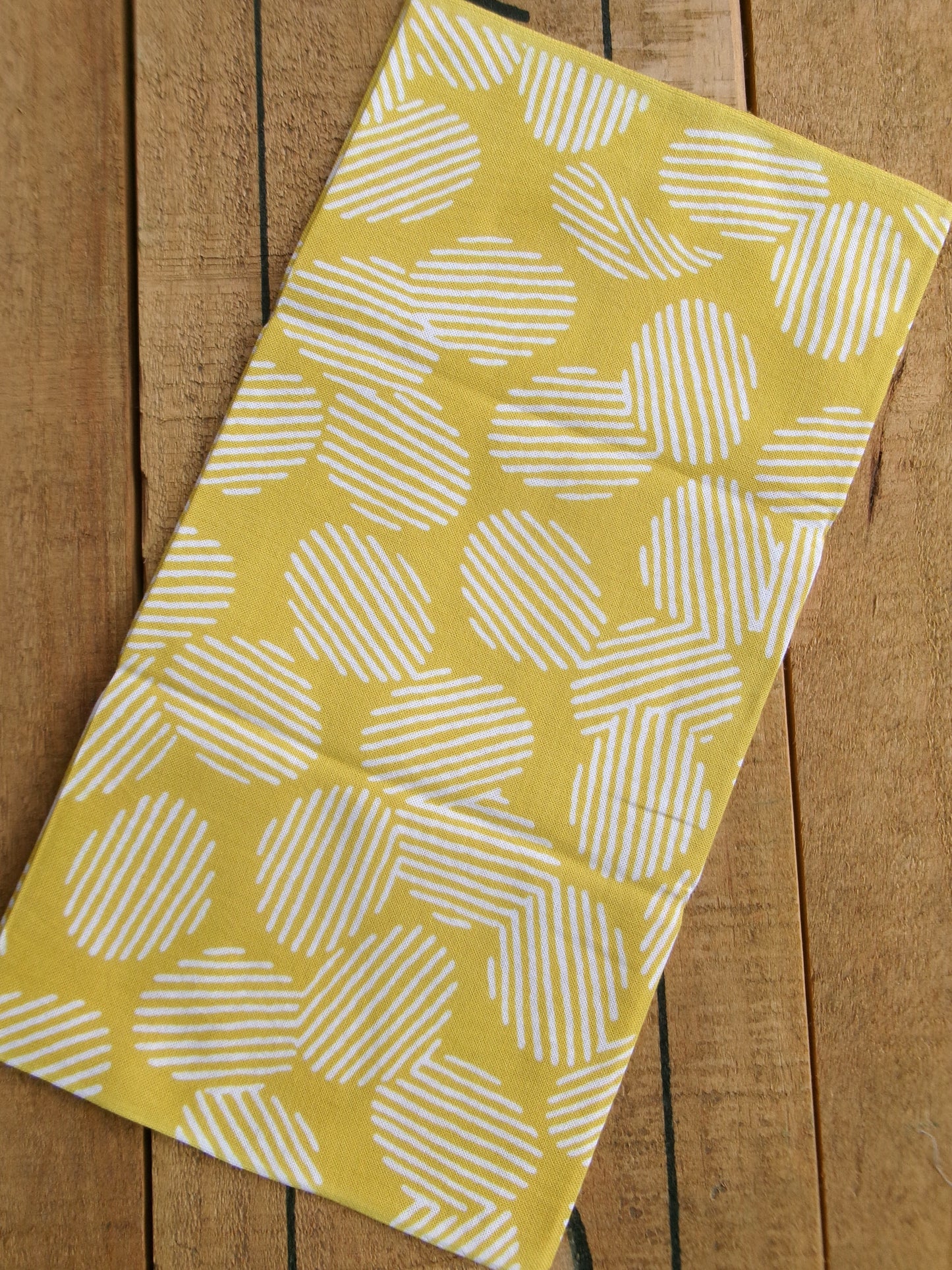 Japanese tenugui towel with potato chips pattern in vibrant colors, featuring the かまわぬ brand logo and detailed potato chip illustrations.