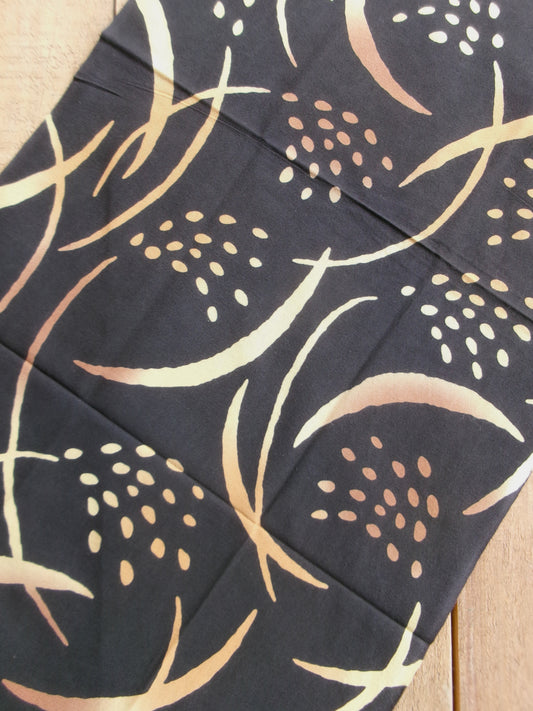 Japanese tenugui towel with golden rice plant design by Kamawanu, featuring traditional textile art and vibrant gold and blue colors.