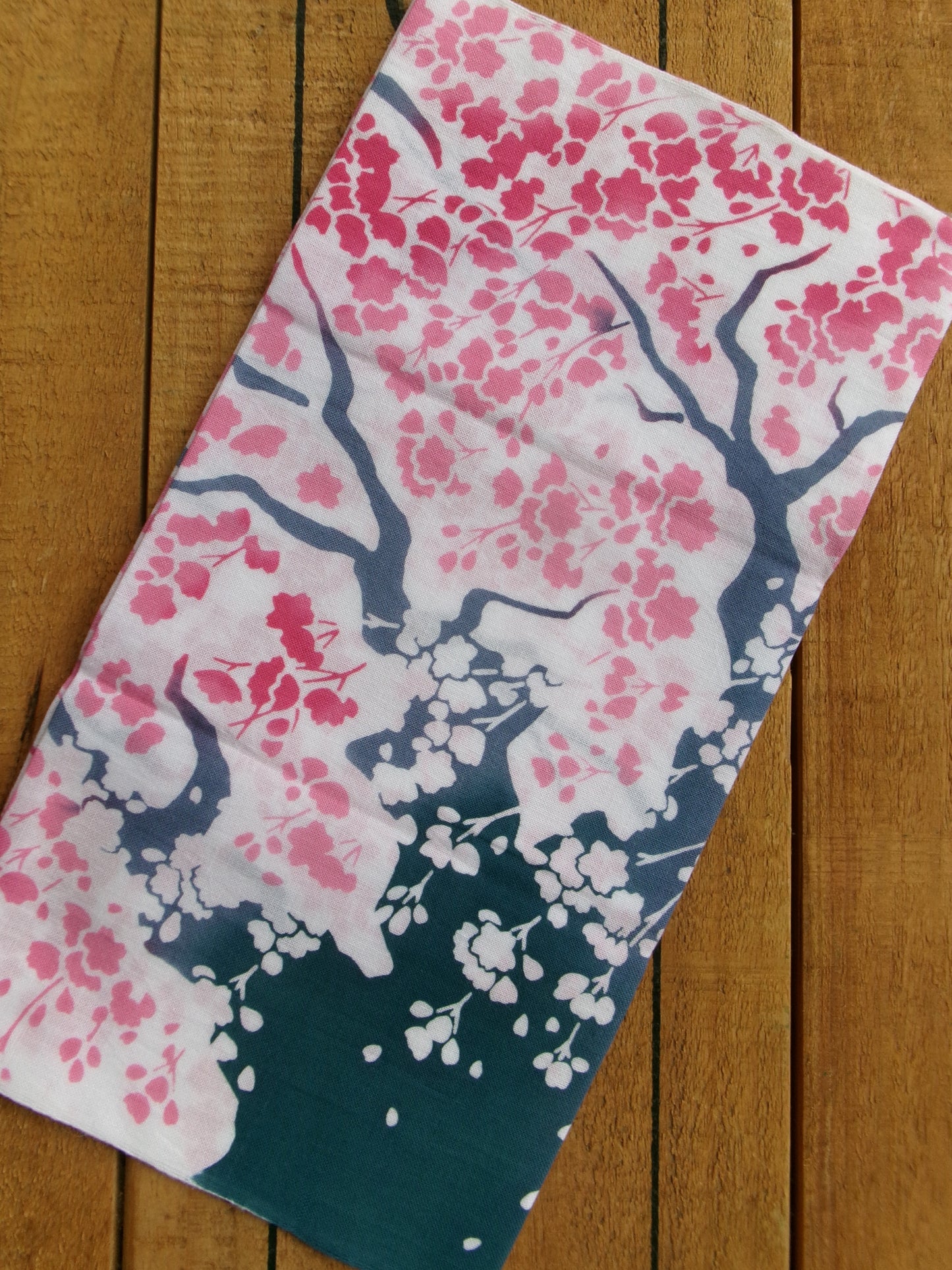 Japanese tenugui towel featuring large cherry blossom (大桜) design by Kamawanu, showcasing traditional fabric with floral pattern.