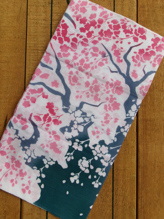 Japanese tenugui towel featuring large cherry blossom (大桜) design by Kamawanu, showcasing traditional fabric with floral pattern.
