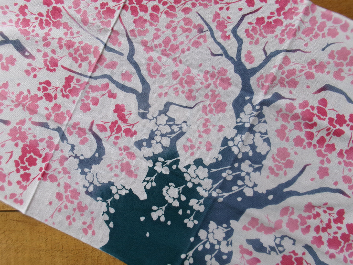 Traditional Japanese tenugui towel with large cherry blossom (大桜) design by Kamawanu, showcasing intricate floral patterns.