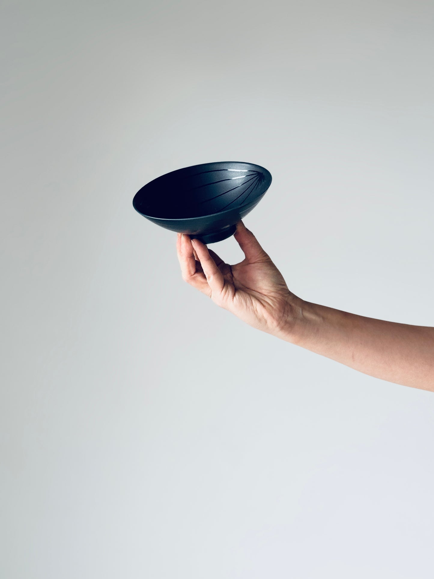 White porcelain tea bowl U-15 by Hakusan Ceramic, featuring a simple round shape and smooth glazed surface.