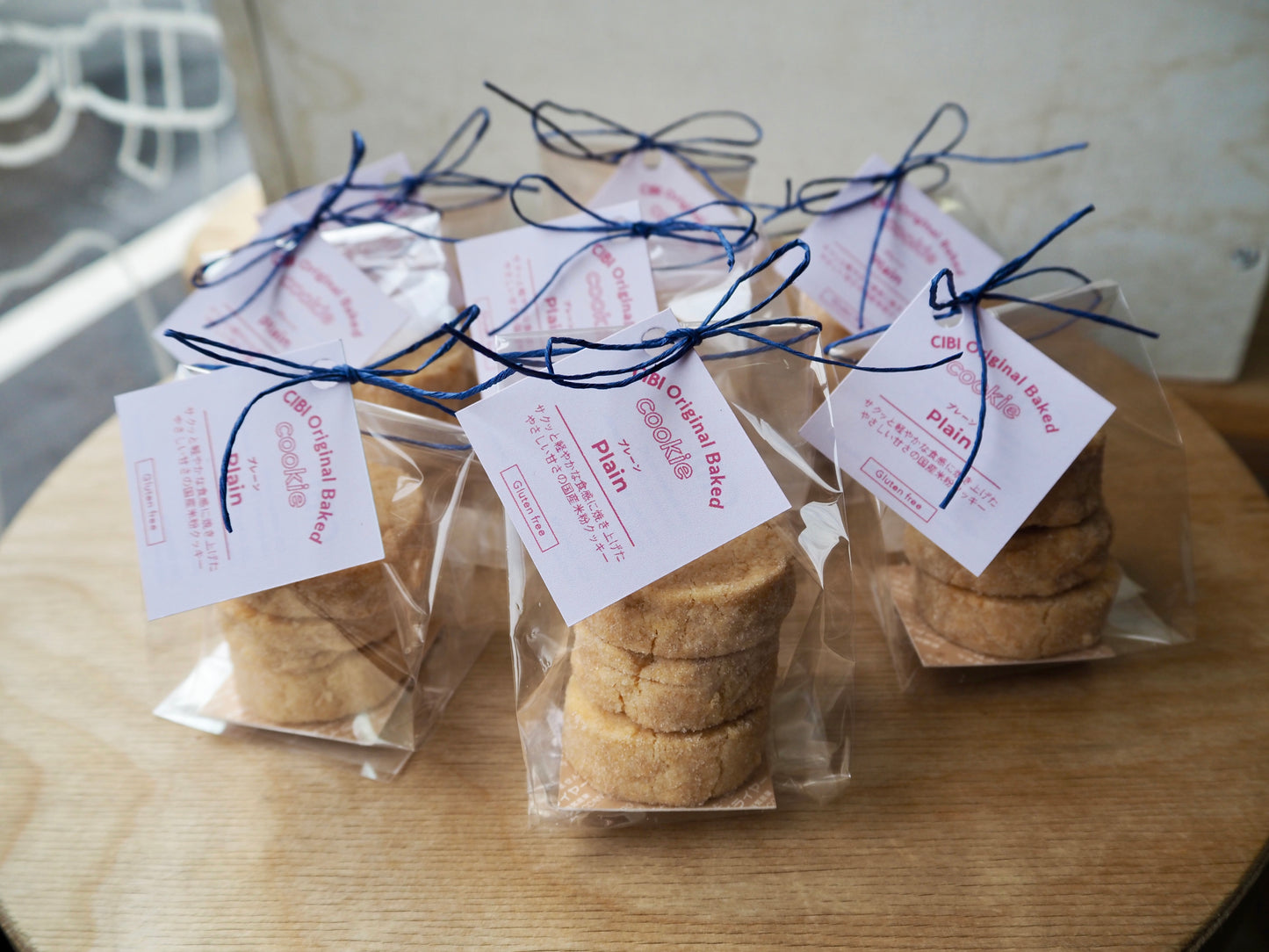Japanese rice flour plain cookies from CIBI TOKYO STORE, three crispy cookies on a white plate with a rustic wooden background.