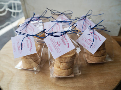 Japanese rice flour plain cookies from CIBI TOKYO STORE, three crispy cookies on a white plate with a rustic wooden background.