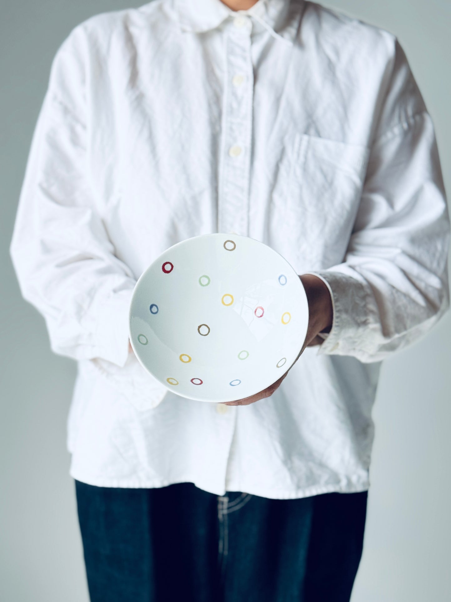 White ceramic tea bowl AB-10 by Hakusan Pottery, showcasing a smooth, round shape and traditional design on a plain background.