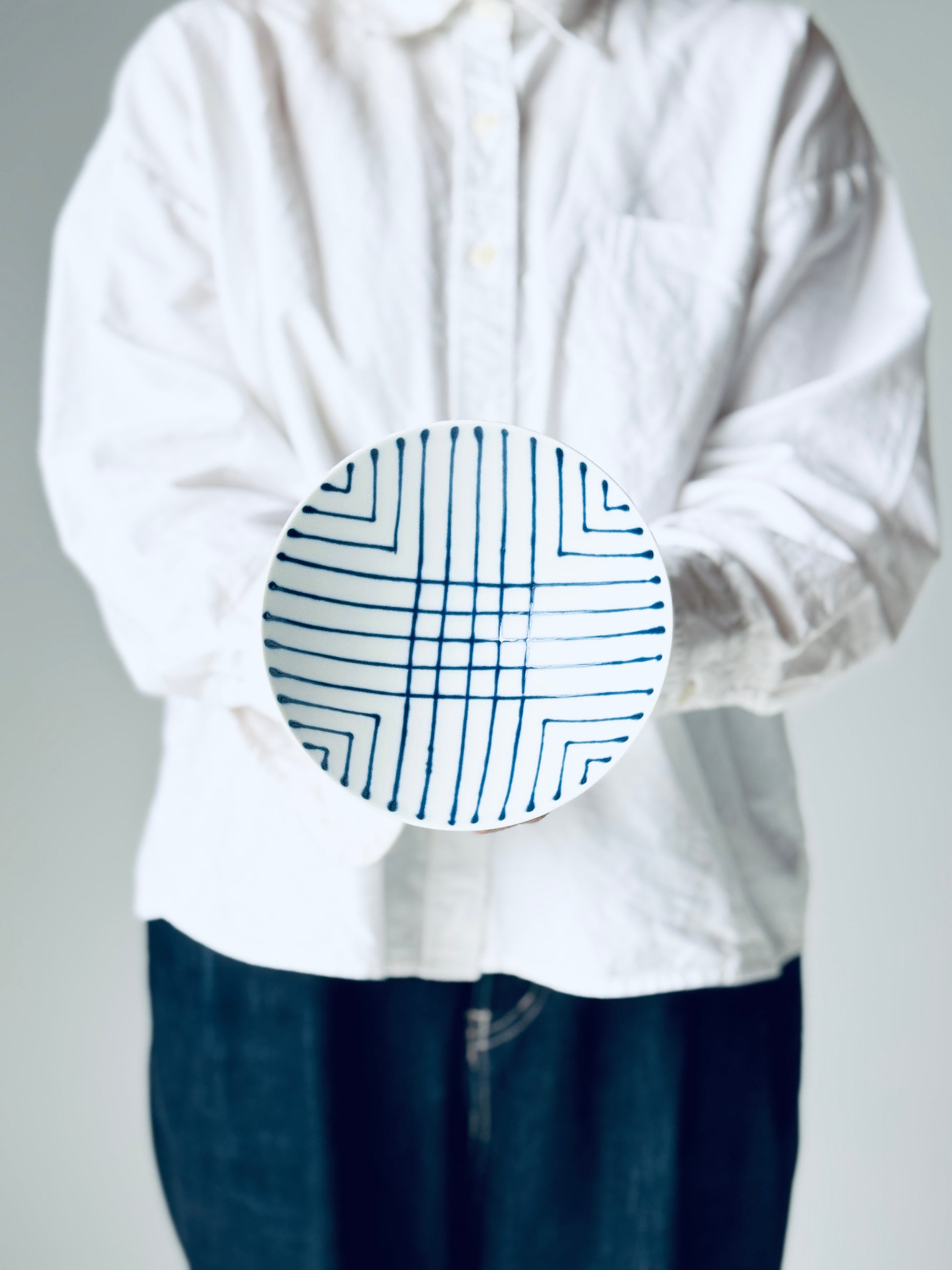White mountain pottery ST-20 tea bowl with simple design and smooth ceramic surface, traditional Japanese style.