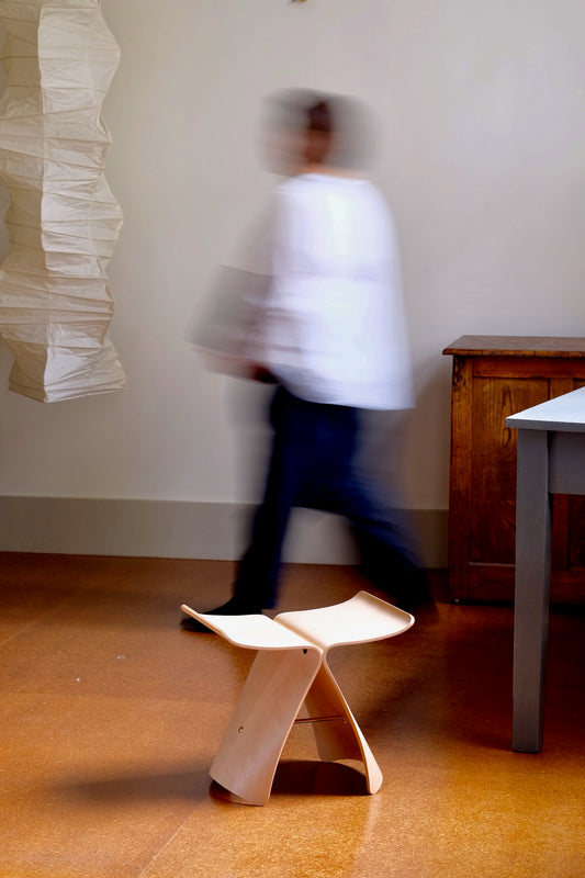 Sori Yanagi butterfly stool by CIBI TOKYO STORE featuring a wooden seat with curved butterfly-shaped design.