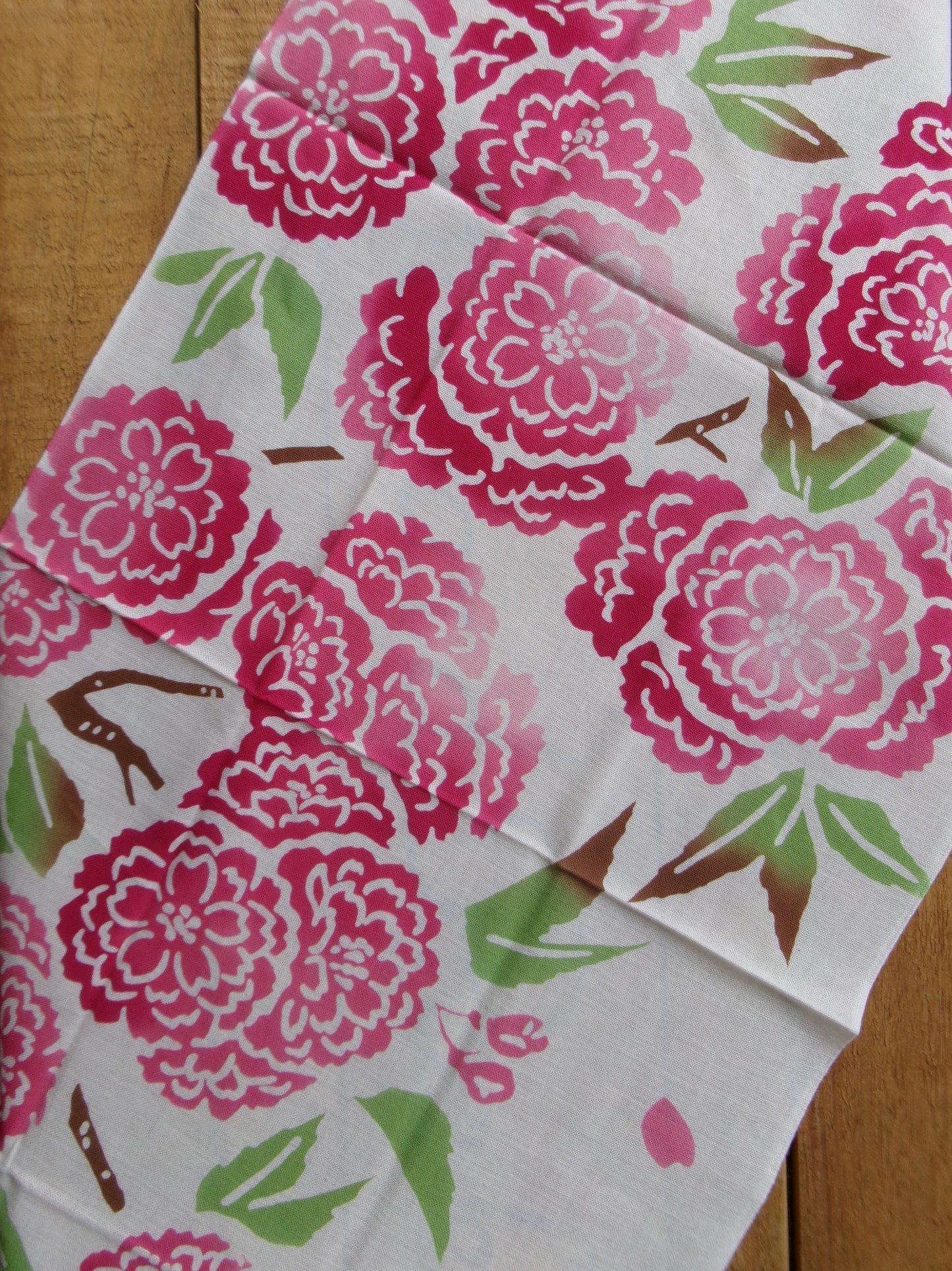 Decorative tenugui fabric with framed Yae Sakura cherry blossom design by Kamawanu, showcasing traditional Japanese textile art.