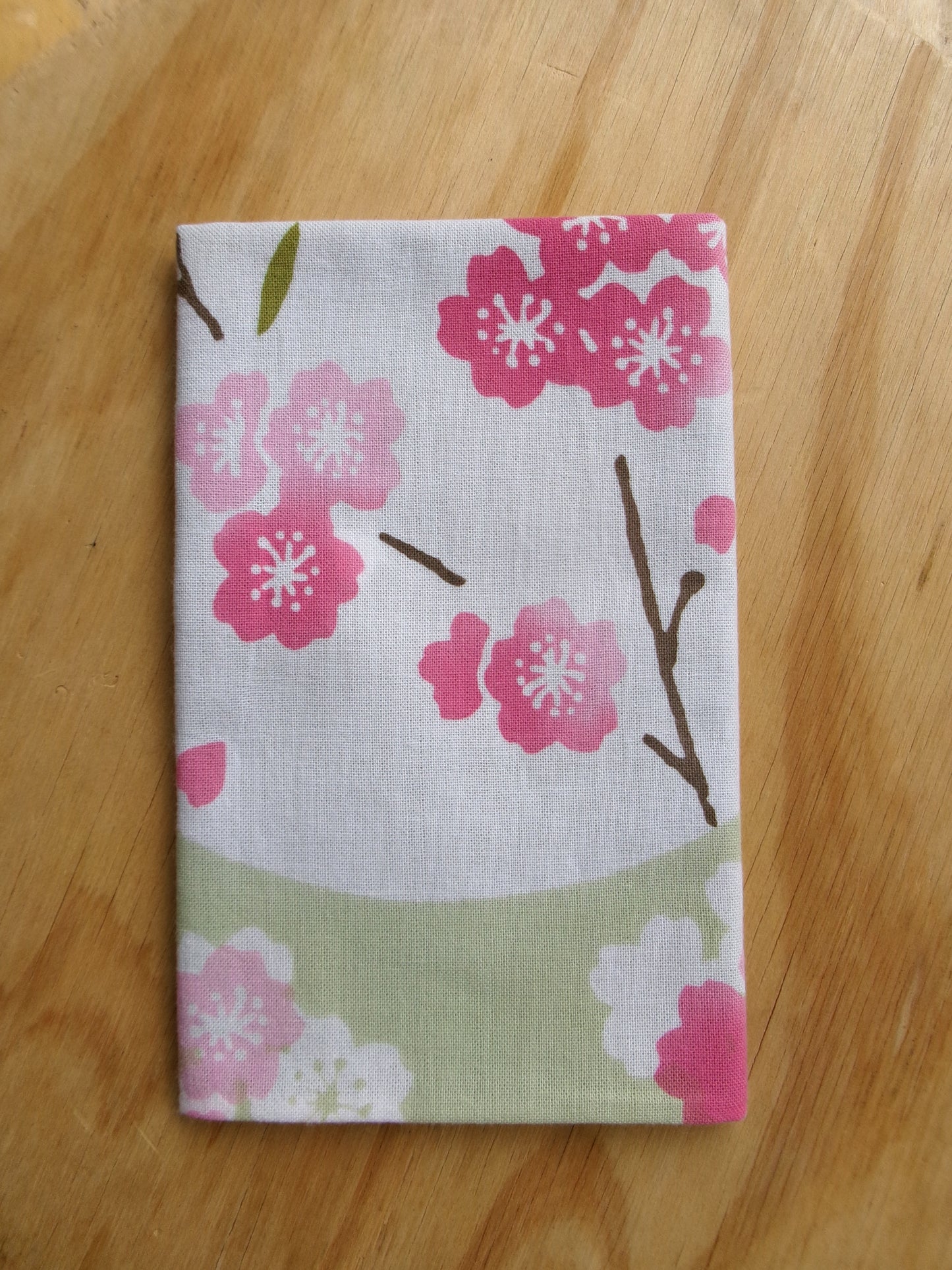 Japanese tenugui towel with cherry blossom and oboro pattern by Kamawanu, featuring intricate sakura and traditional design details.