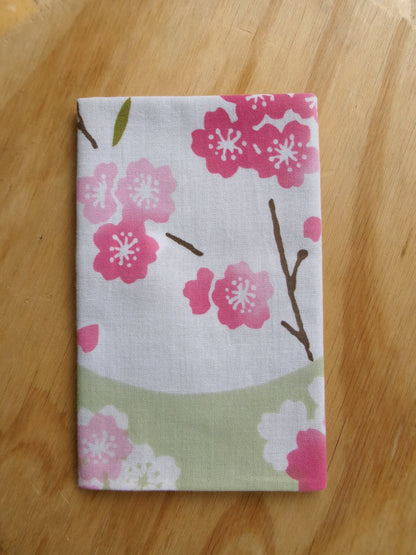 Japanese tenugui towel with cherry blossom and oboro pattern by Kamawanu, featuring intricate sakura and traditional design details.