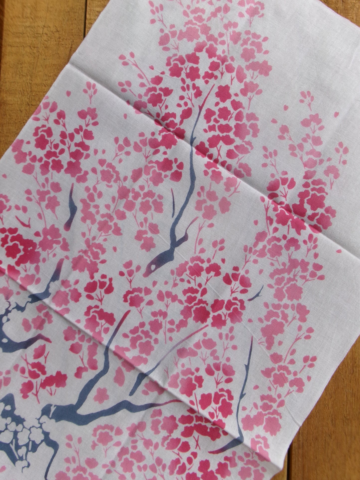 Colorful tenugui cloth featuring large cherry blossom (大桜) design by Kamawanu, showcasing traditional Japanese textile art.