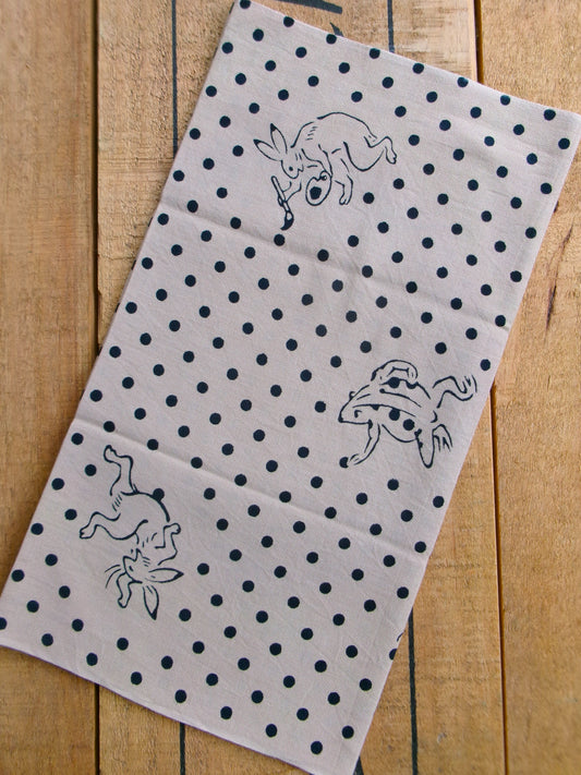 Beige tenugui featuring traditional Mameshibori pattern with bird and beast motifs, by Kamawanu, showcasing intricate Japanese textile design.