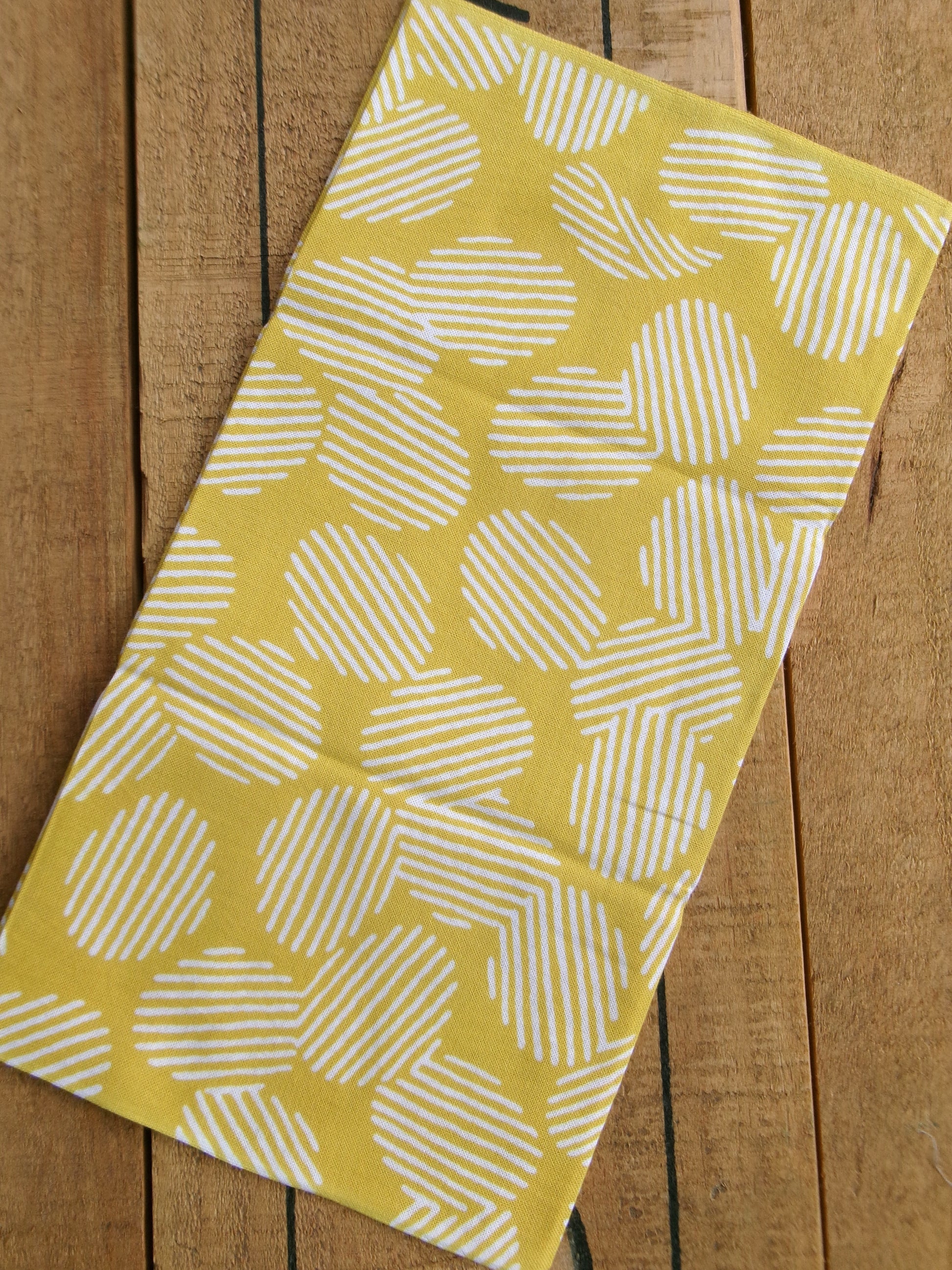 Japanese tenugui towel with potato chips pattern in vibrant colors, featuring the かまわぬ brand logo and detailed potato chip illustrations.