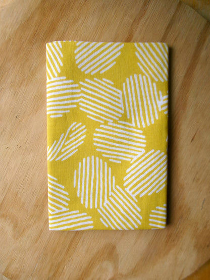 Japanese tenugui towel featuring colorful potato chips pattern by Kamawanu, traditional cloth with vibrant snack design.
