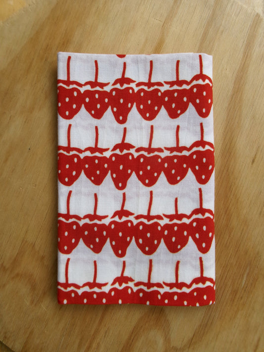 Japanese tenugui cloth with strawberry pattern by Kamawanu, featuring vibrant red strawberries on a traditional fabric background.