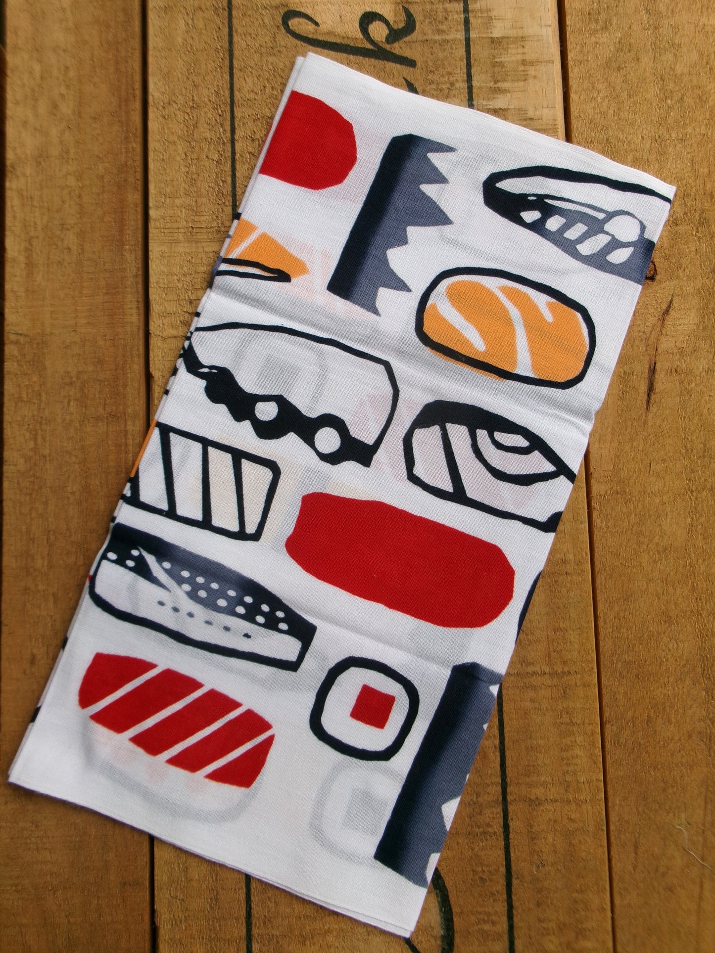 Japanese tenugui towel with sushi design by Kamawanu, featuring traditional Japanese sushi illustrations and vibrant colors.
