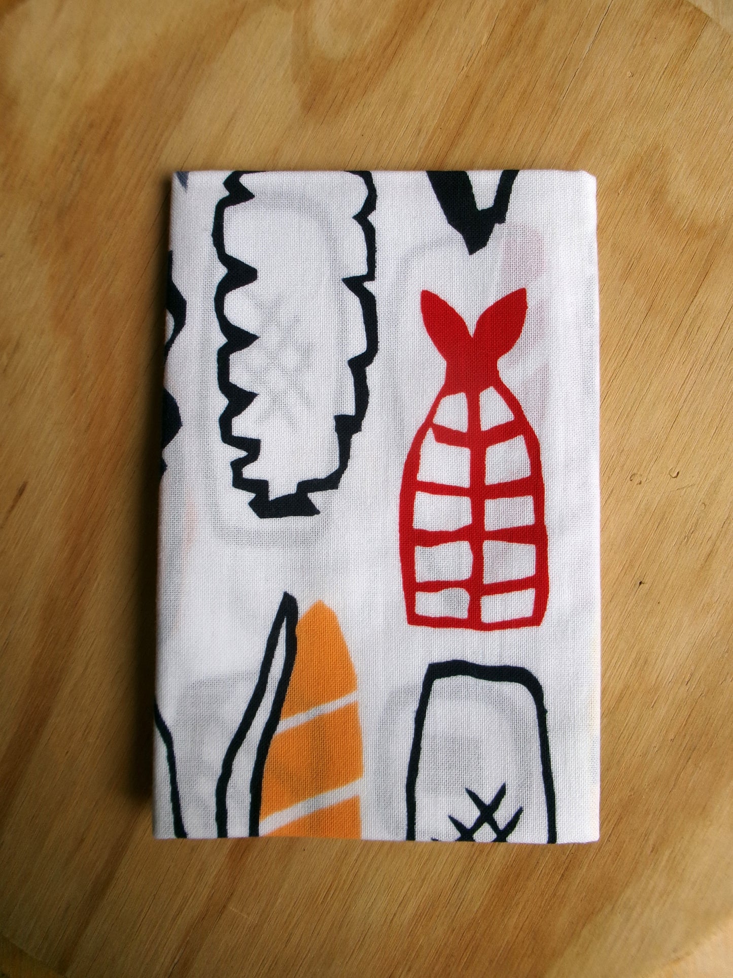 Cotton tenugui towel featuring sushi-themed design by Kamawanu, showcasing traditional Japanese patterns and vibrant sushi illustrations.